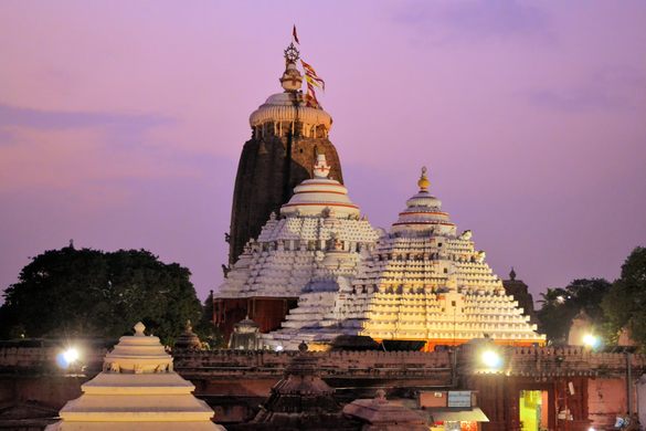 The illuminated temple at night, adorned with numerous lights, creates a mesmerizing spectacle.