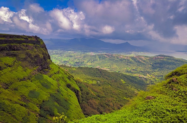 Beautiful view of green mountains with cloud covered sky during monsoon