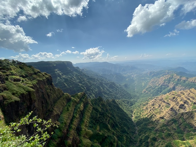 Scenic view of mountains and valleys with Blue sky and scattered clouds