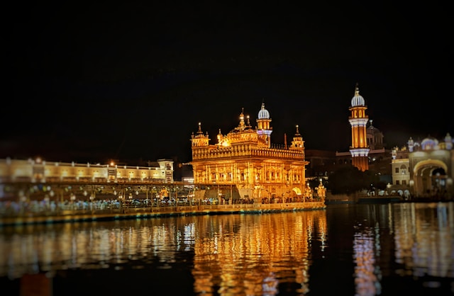 The Golden Temple in Amritsar, India - a majestic religious site with a golden exterior, reflecting serenity and spiritual significance.