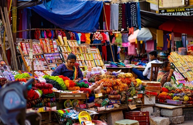 A vibrant street market showcasing a variety of colorful items available for purchase