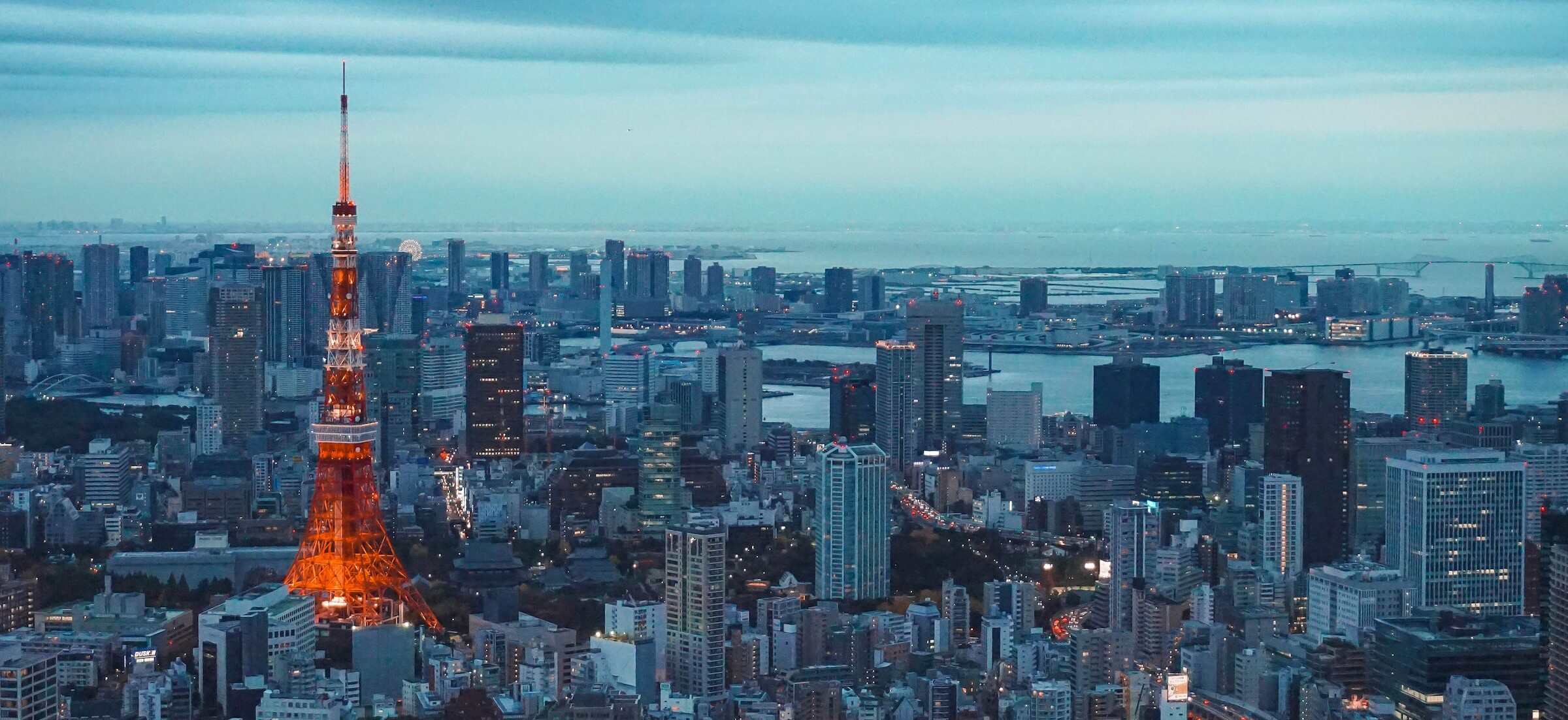 Tokyo Tower, a prominent landmark in Tokyo, Japan, stands tall against the city skyline.