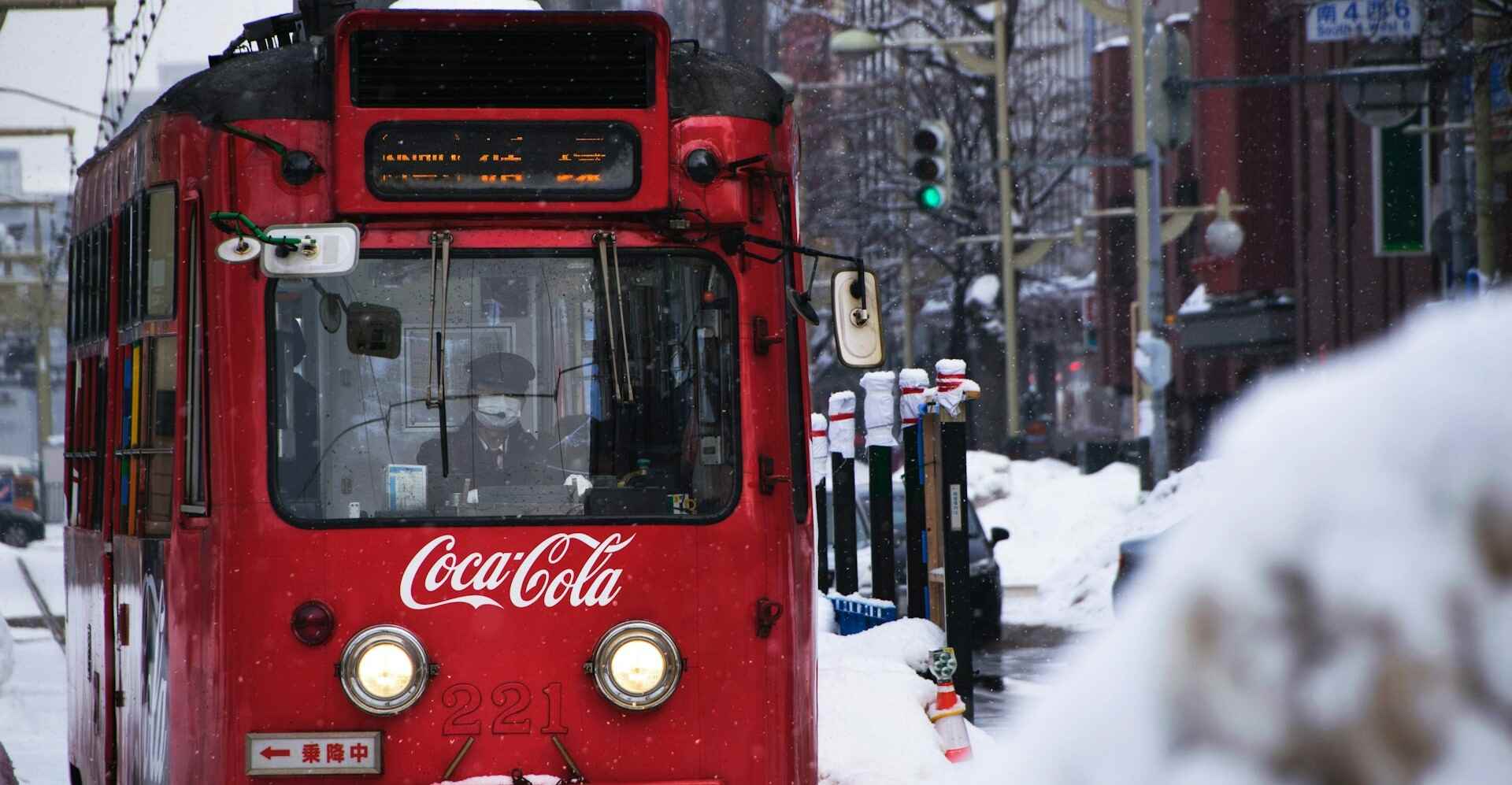 Red train with Coca Cola logo on the front