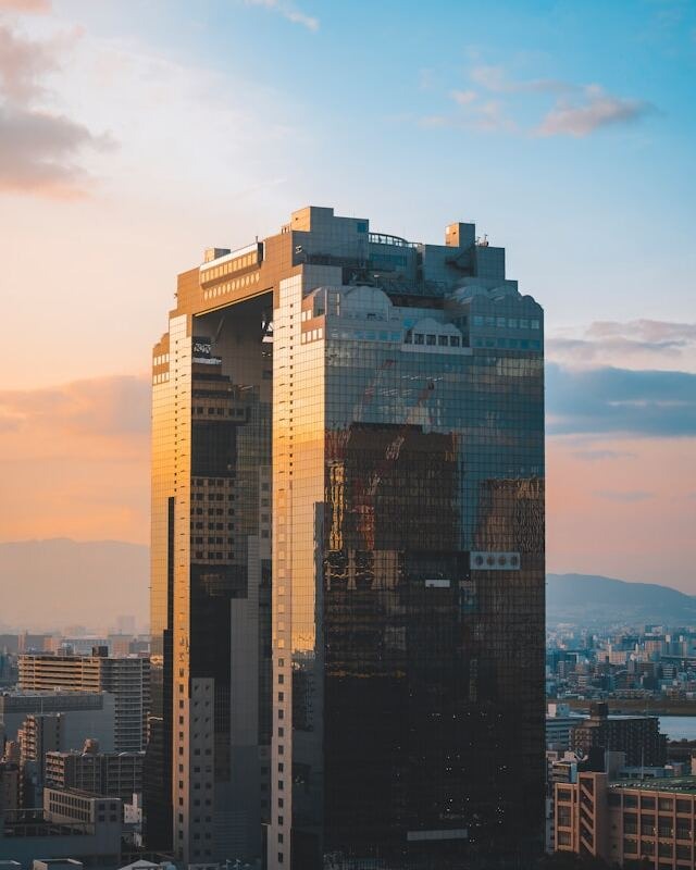 Aerial view of city from high-rise building, capturing urban landscape and skyscrapers.