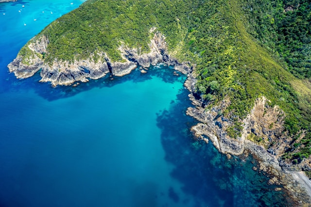 A breathtaking aerial view of New Zealand's stunning coastline, showcasing its natural beauty and captivating landscapes.