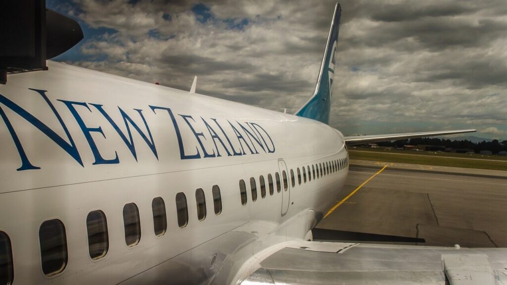 A white airplane with New Zealand written over it