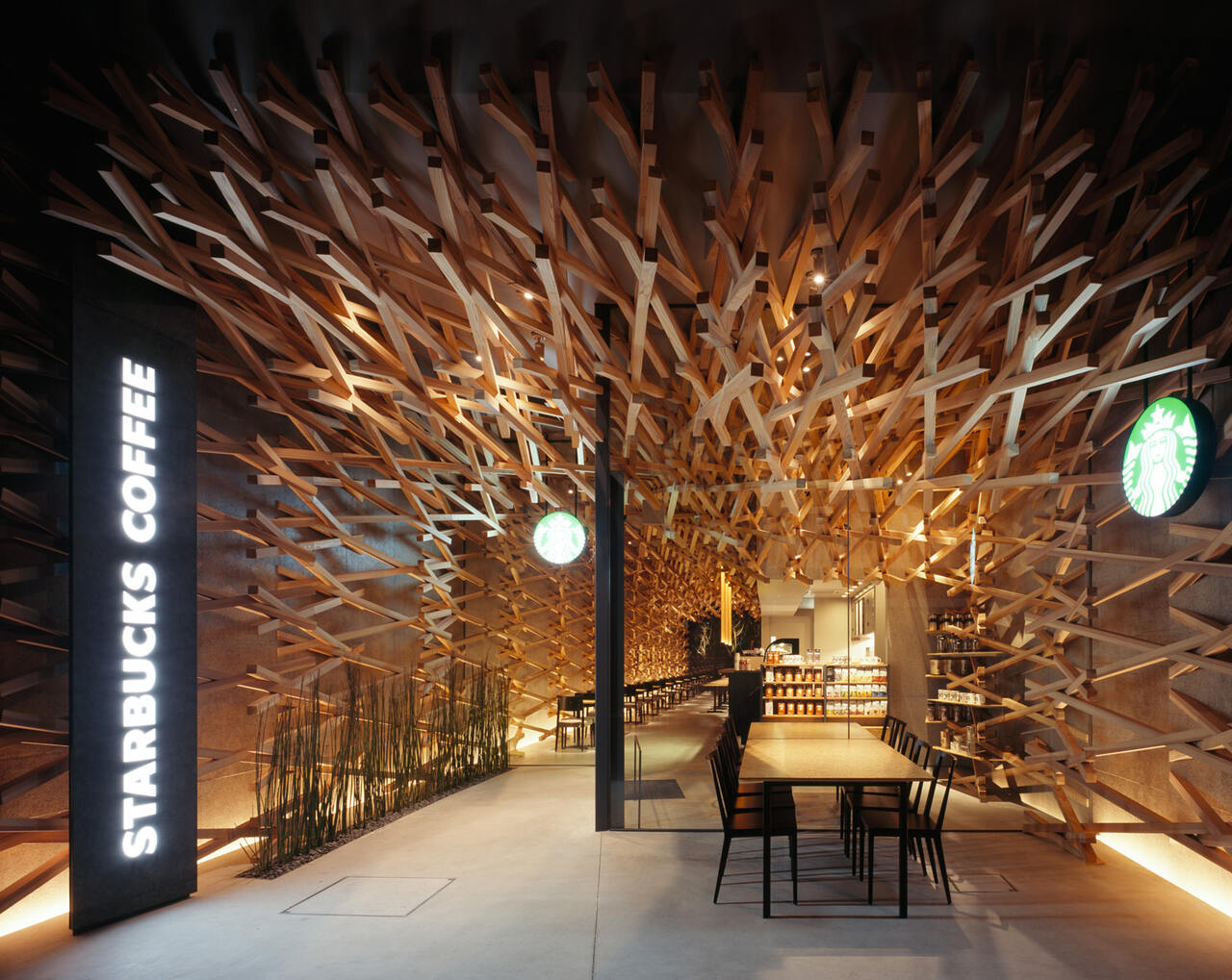 A Starbucks coffee shop with warm wooden walls and tables, creating a cozy and inviting atmosphere.